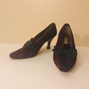 Purple shoes with black bow